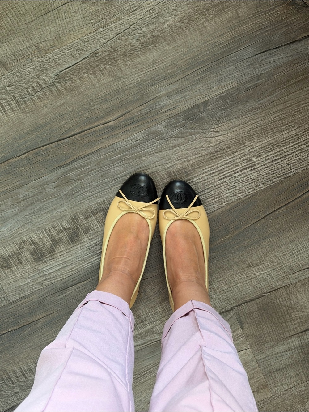 CHANEL Two-Tone Leather Ballet Flats in Cream and Black